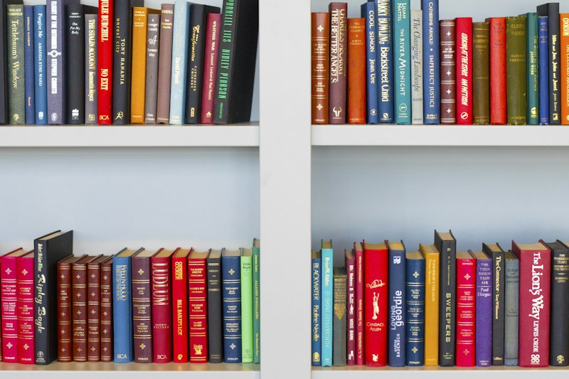 Stack of comforting books on wooden table